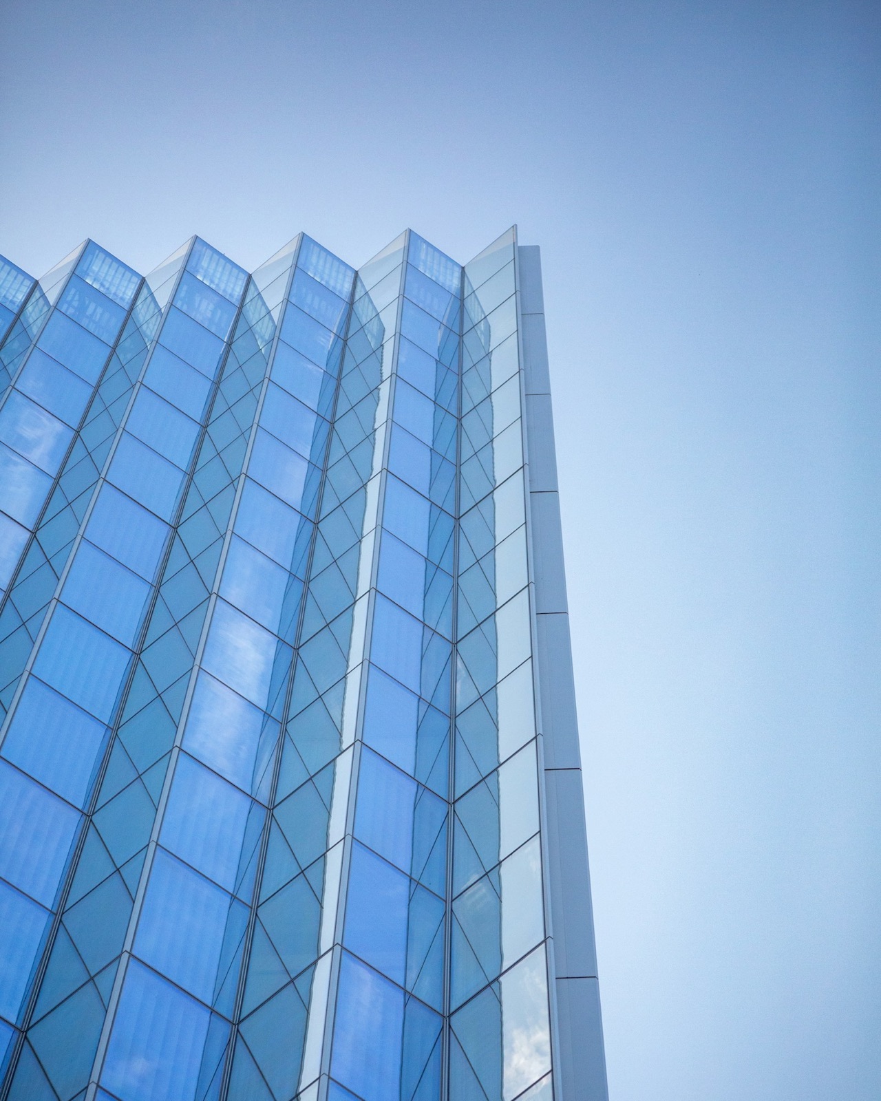 Modern blue glass corporate headquarters building