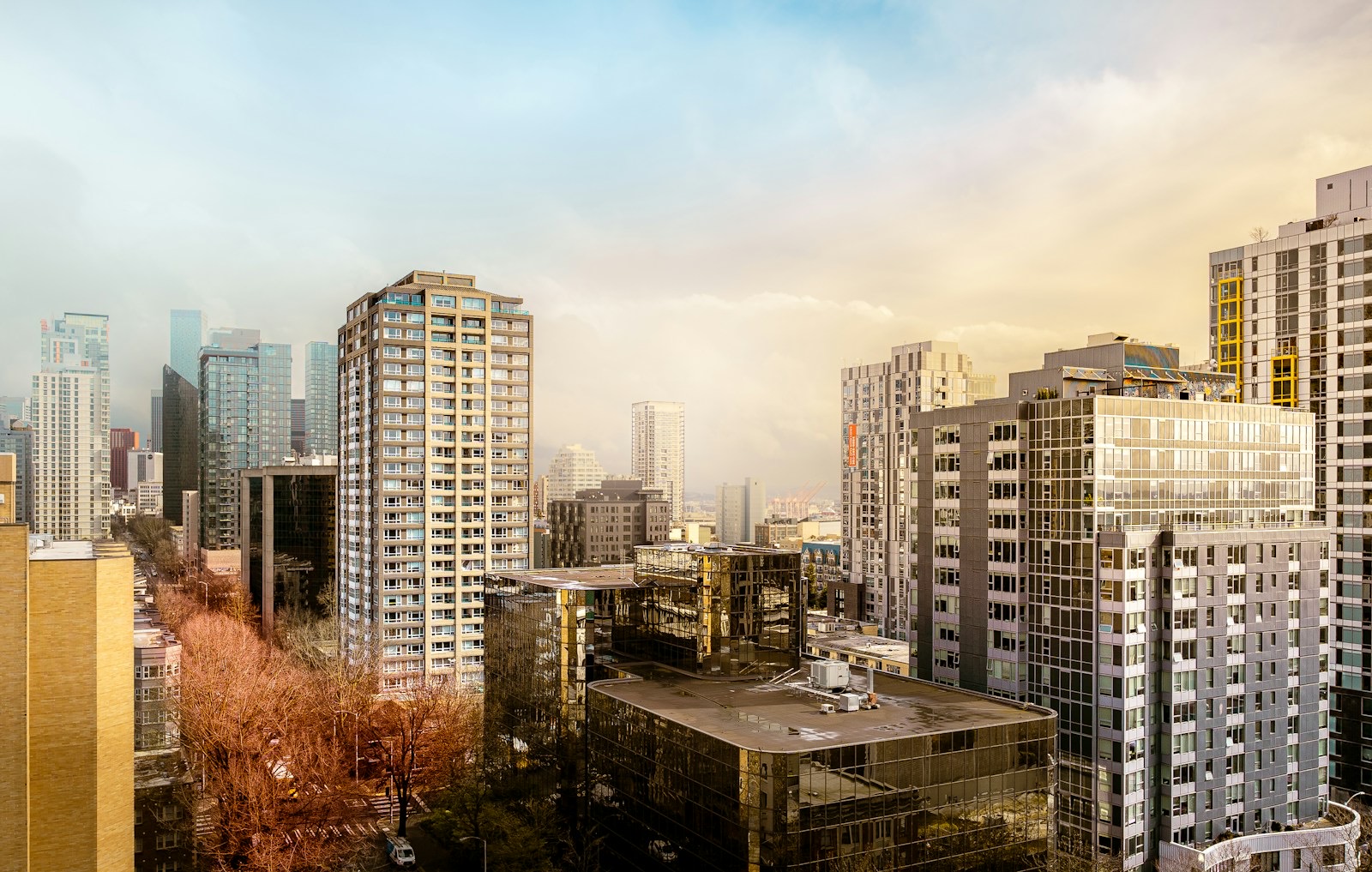 City skyline of residential and commercial towers representing the property sector